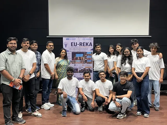 A large group in matching IEEE Eu-Reka t-shirts in front of the Eu-Reka banner